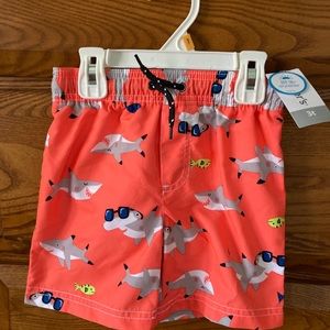 Carter’s Boys orange swim trunks with sharks